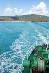 An electric anchor windlass in use on deck to pull mooring ropes