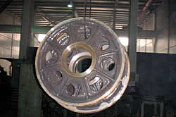 A heavy duty sheave with holes to reduce the overall weight